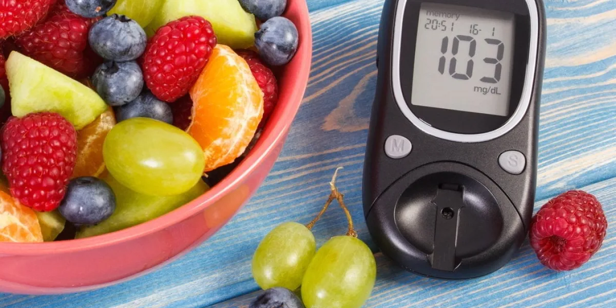 fresh fruit salad and glucometer with result of measurement sugar level, concept of diabetes, diet, slimming, healthy lifestyles and nutrition fresh fruit salad and glucometer with result of measurement sugar level, concept of diabetes, diet, slimming, healthy lifestyles and nutrition