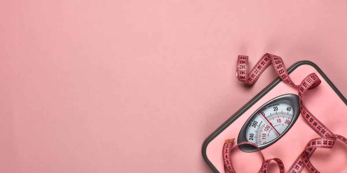 female fitness still life scales and measuring tape on pink background mockup planning of diet and trainings top view with copy space healthy lifestyle concept slimming female fitness still life scales and measuring tape on pink background mockup planning of diet and trainings top view with copy space healthy lifestyle concept slimming