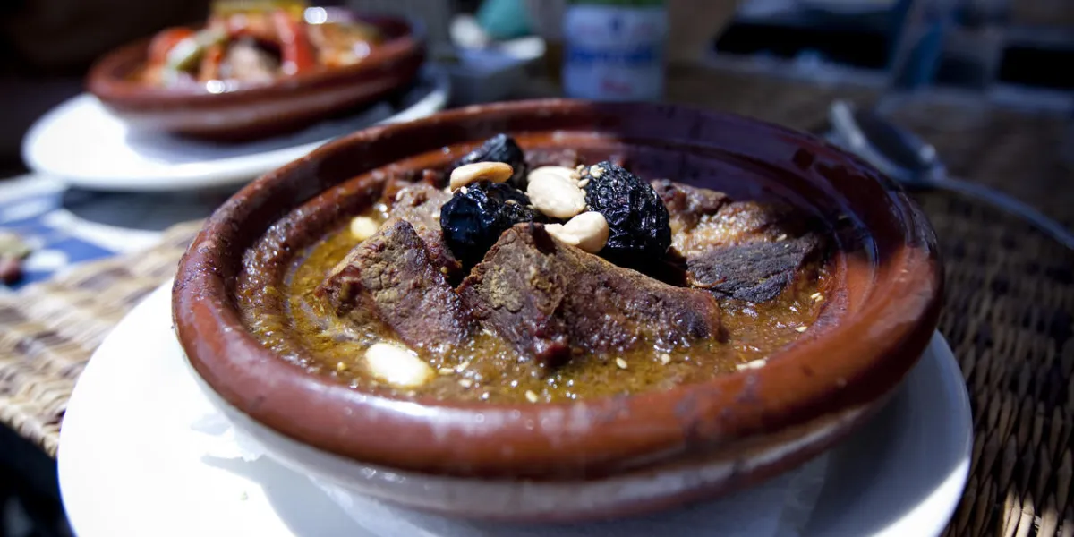 traditional moroccan dish - tagine with prunes and almonds traditional moroccan dish - tagine with prunes and almonds