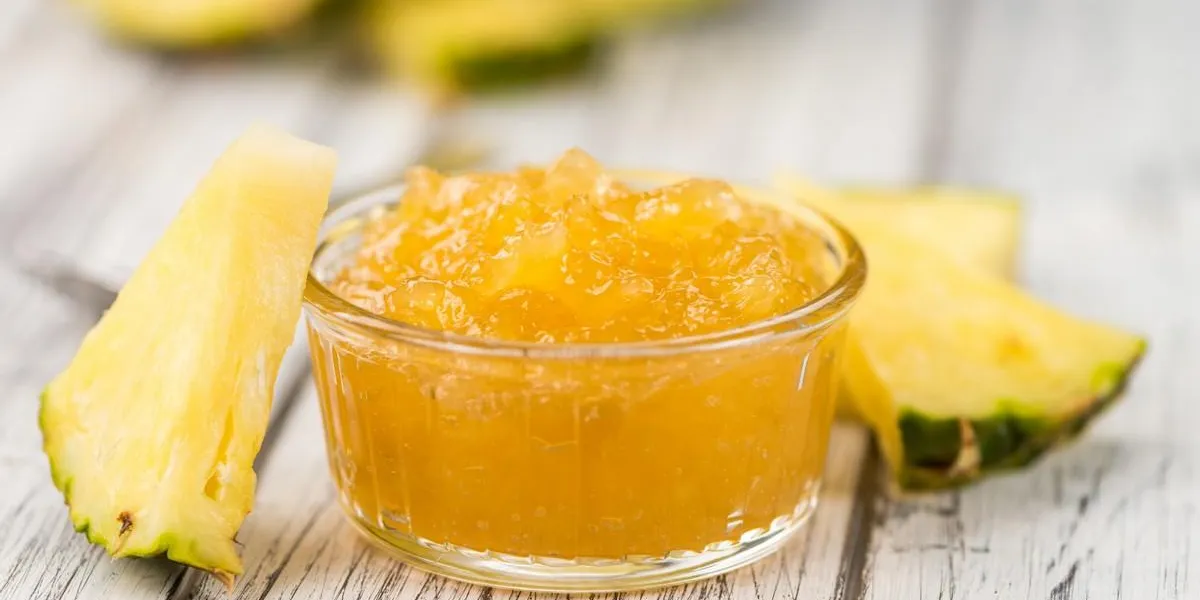 some homemade pineapple jam as detailed close-up shot, selective focus
