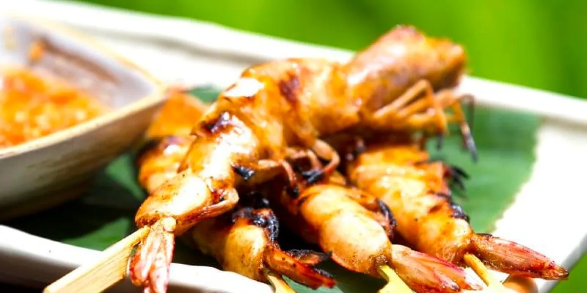 grilled shrimp on skewers with sauce