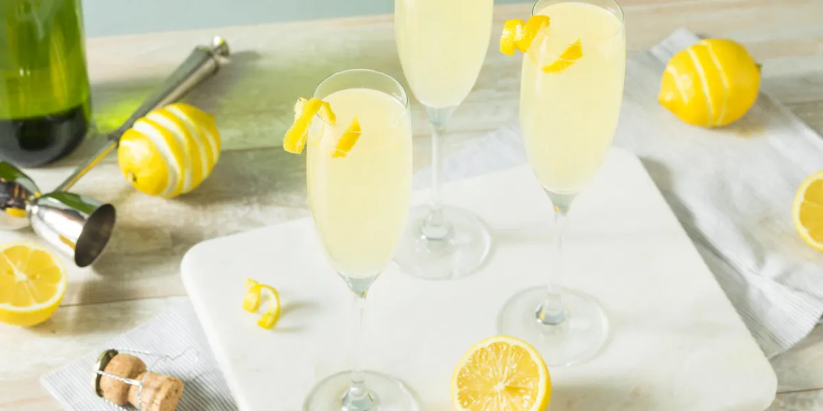 boozy bubbly lemon french 75 cocktail with champagne