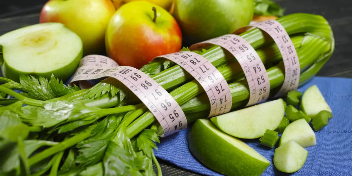 green vegetables and fruits - celery shoots and apples, healthy fitness diet concept green vegetables and fruits - celery shoots and apples, healthy fitness diet concept