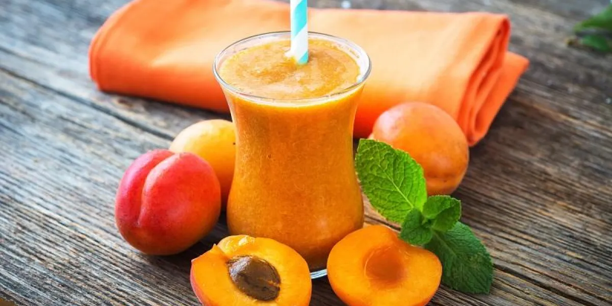 fresh apricot smoothie and apricots on wooden background fresh apricot smoothie and apricots on wooden background