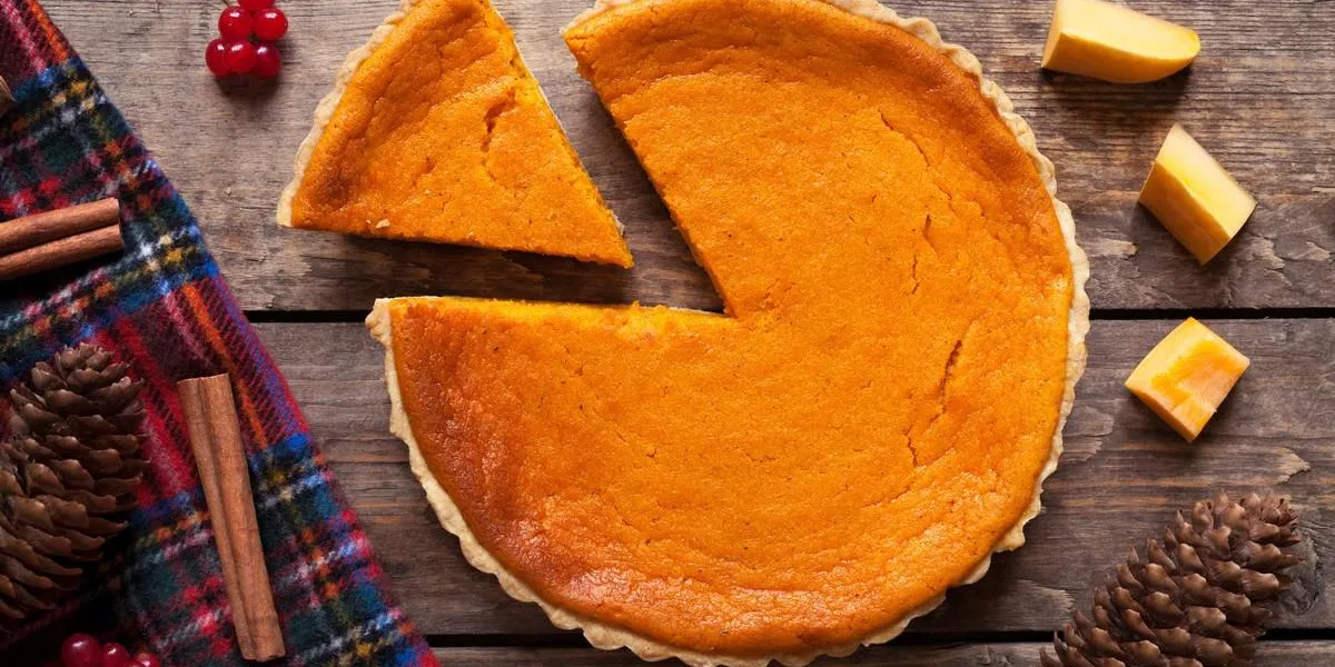 homemade sliced pumpkin tart pie recipe with cinnamon and nuts on vintage wooden table background halloween party traditional dessert rustic style homemade sliced pumpkin tart pie recipe with cinnamon and nuts on vintage wooden table background halloween party traditional dessert rustic style