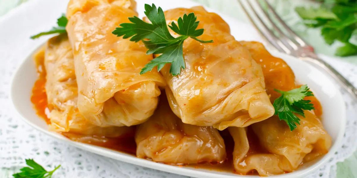 stuffed cabbage rolls with rice and meat in tomato sauce