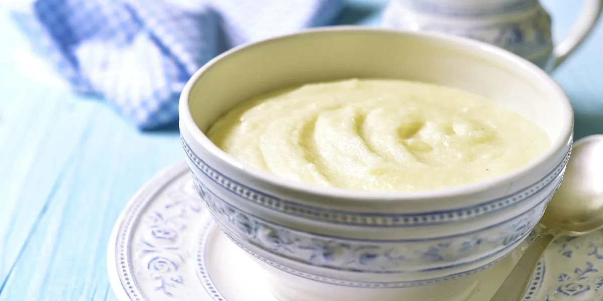 semolina porridge in a vintage bowle for a breakfast on blue wooden table semolina porridge in a vintage bowle for a breakfast on blue wooden table