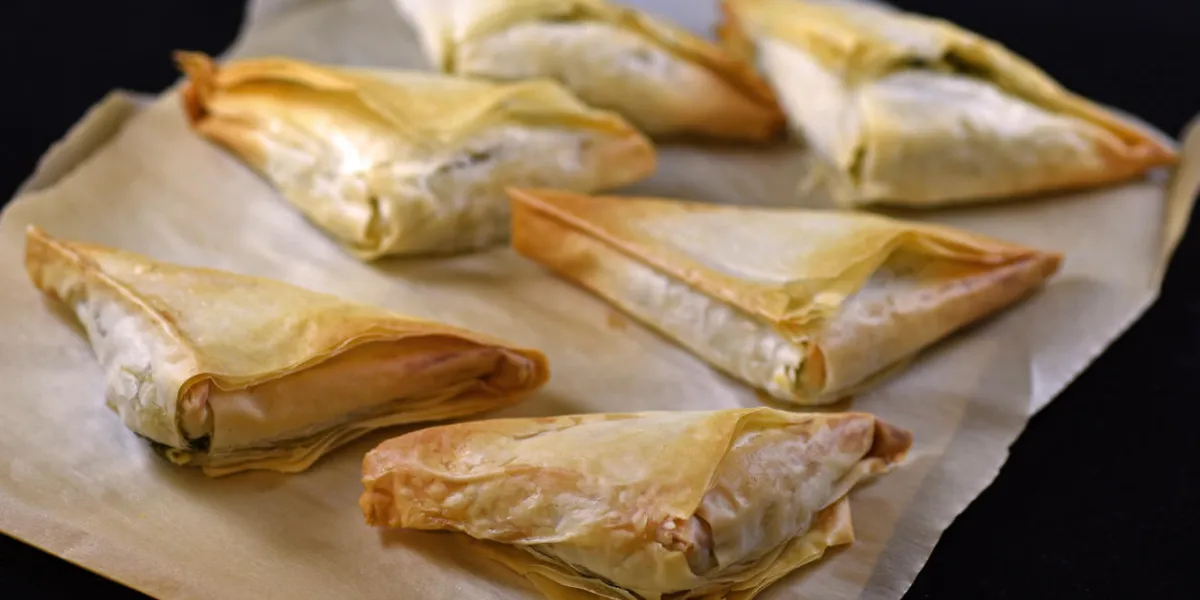 a batch of baked greek spanakopita