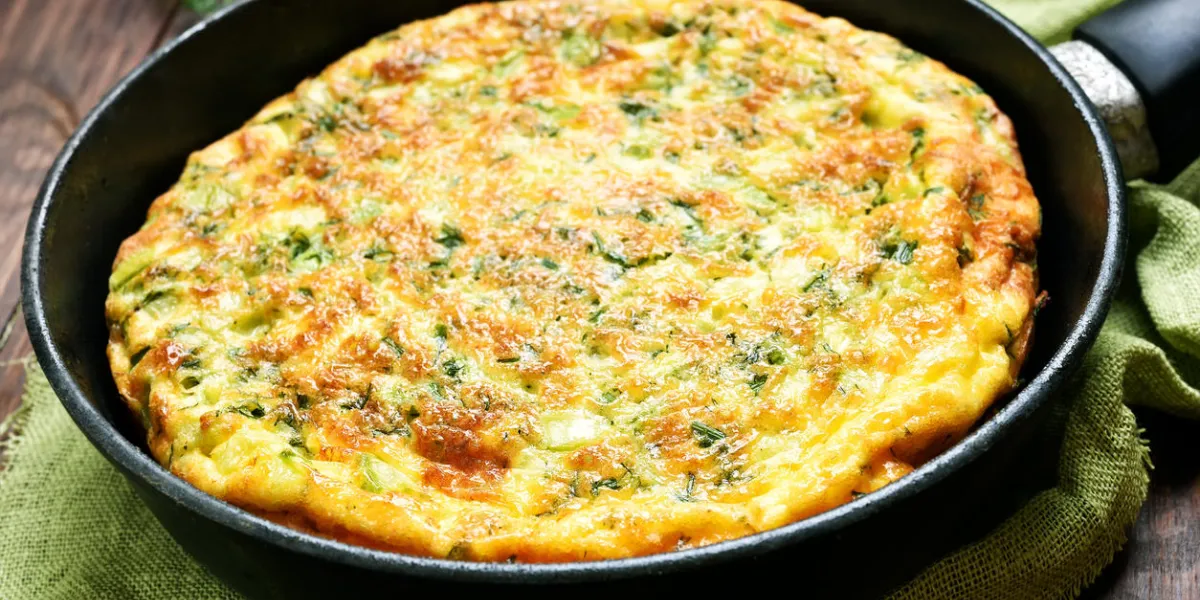 omelet in frying pan, close up view, shallow depth of field