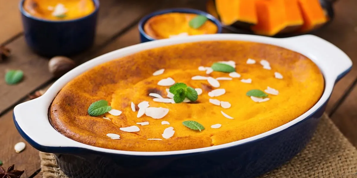 cottage cheese and pumpkin pudding with cinnamon and nutmeg on wooden background cottage cheese and pumpkin pudding with cinnamon and nutmeg on wooden background