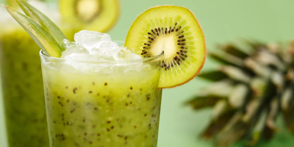 fresh kiwi smoothie over green background[url=http   wwwistockphotocom search lightbox 8850381][img]http   wwwblueorangestudiocom banners food n drinksjpg[ img][ url]