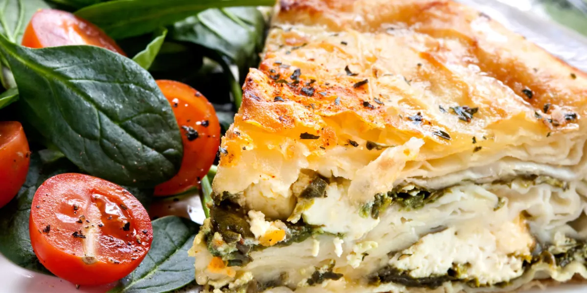 spinach and feta pie in filo pastry, with salad traditional greek spanakopita spinach and feta pie in filo pastry, with salad traditional greek spanakopita