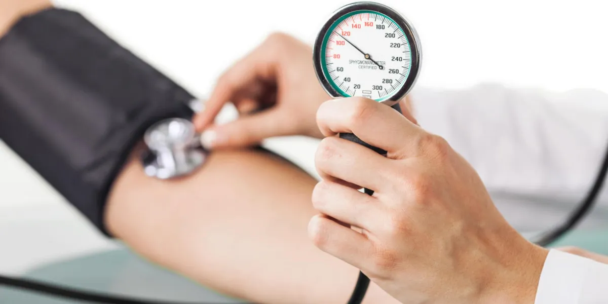 closeup of a doctor taking blood pressure closeup of a doctor taking blood pressure